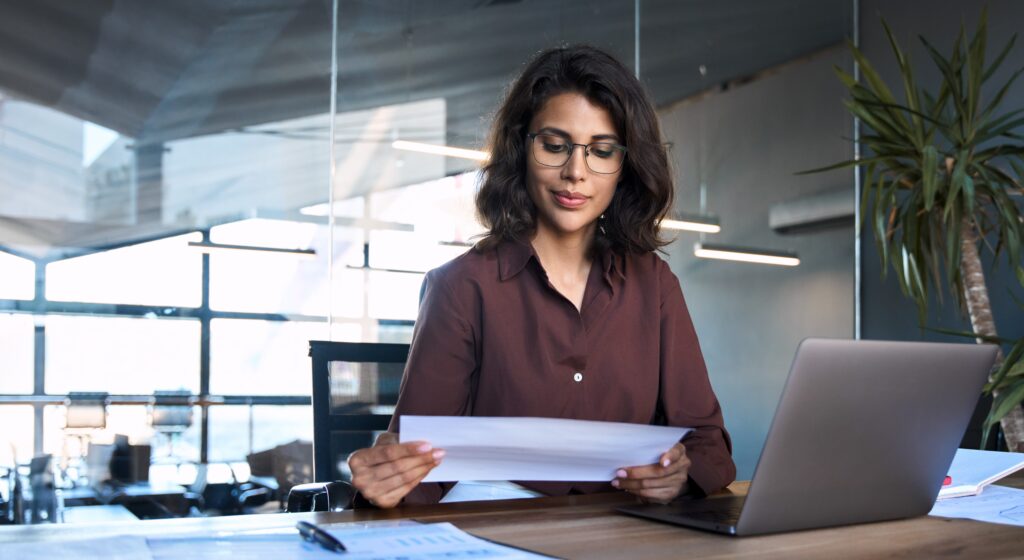 woman who owns business looking at taxes for 2025